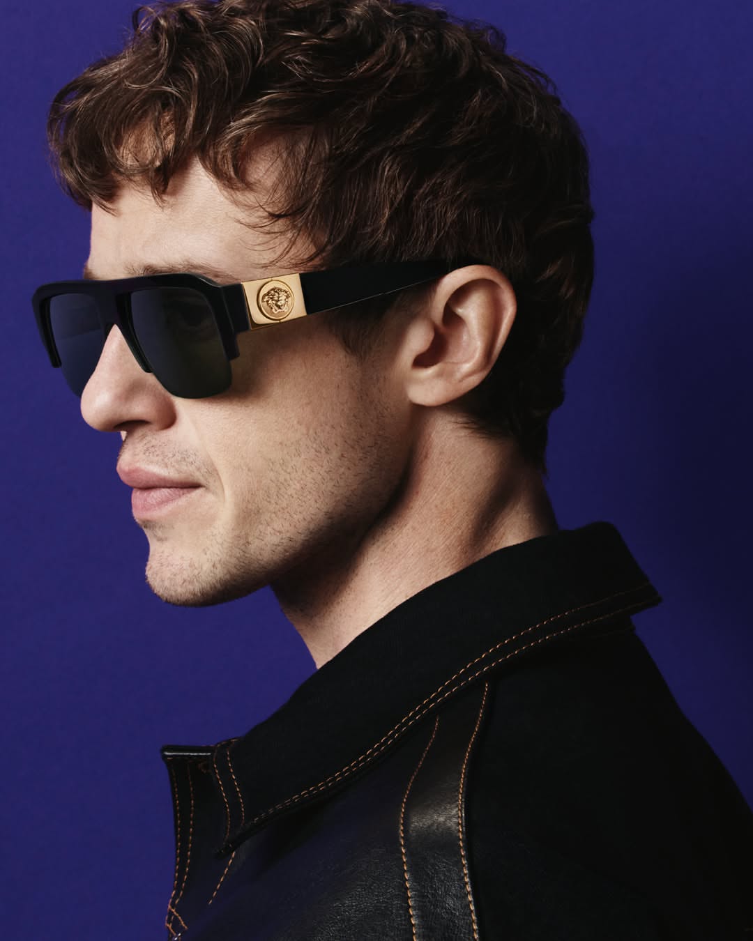 Versace Fall Winter 2026 eyewear — a study of mood and gesture, starring Joseph Quinn. Photographed by Heikki Kaski.