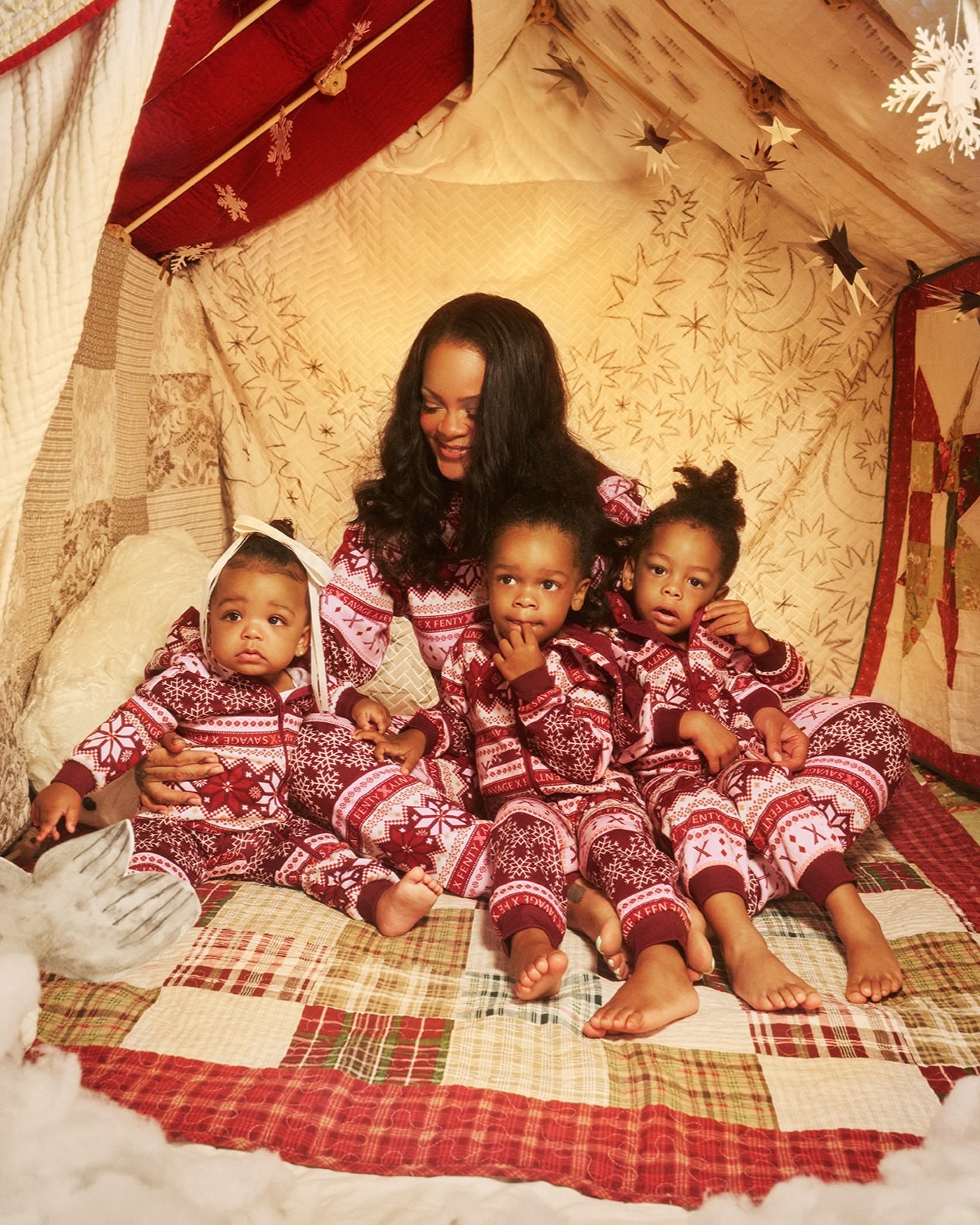 Cozy up to a little holiday magic in matching onesies 💫