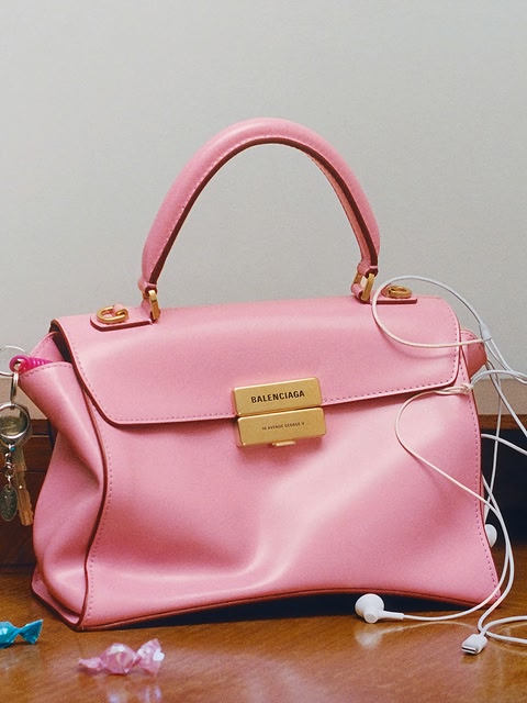 Hourglass Avenue Bag Featuring Anna Van Patten. The Hourglass Avenue Bag in pink will be available in January 2027 in stores and on balenciaga.com