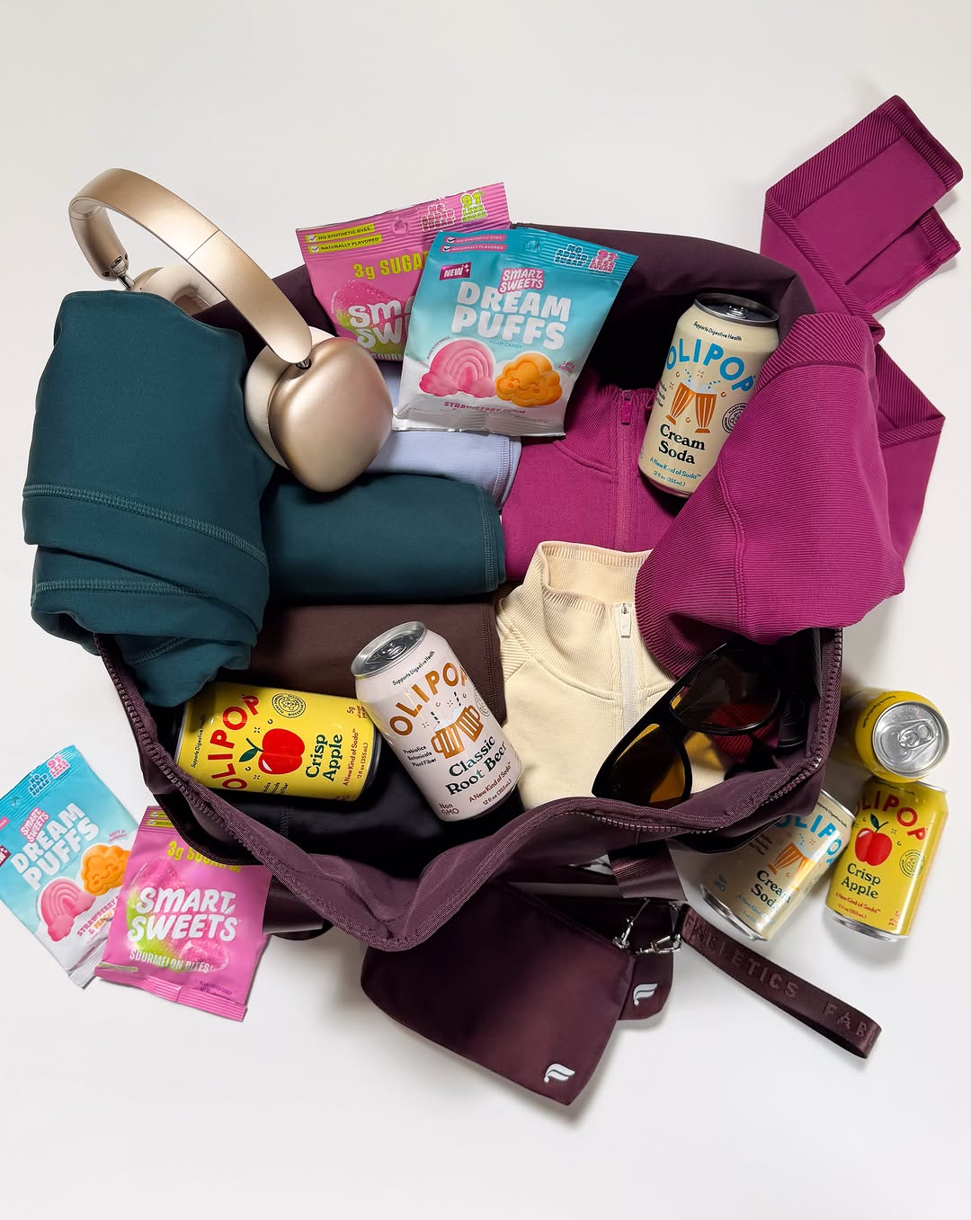 Your fall packing list just got sweeter ✈️ We’ve teamed up with @drinkolipop and @smartsweets to give one lucky winner the ultimate travel bundle: a $250 Fabletics gift card, 4 boxes of assorted SmartSweets, including…