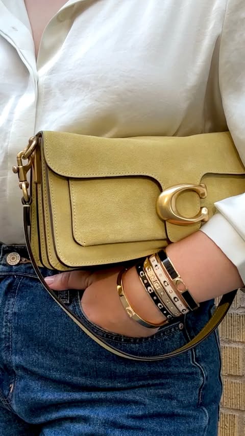 They really do complete the look 🙌 #CoachNY #Bangles #BraceletStack