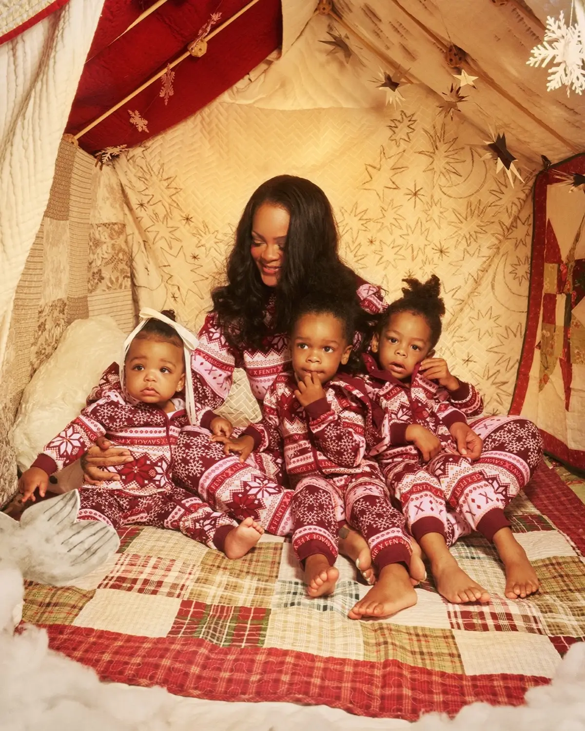 Cozy up to a little holiday magic in matching onesies 💫