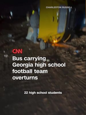 A bus carrying a Georgia high school football team overturned late Friday night, resulting in 22 students and three staff members being hospitalized, according to the school district.
