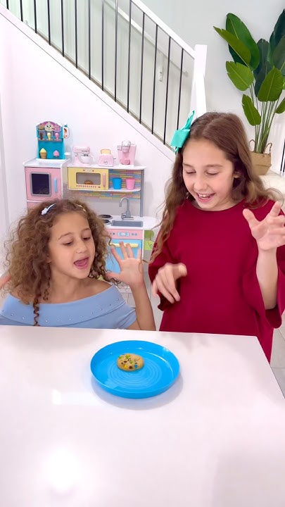 Sierra and Rhia sharing cookies with each other